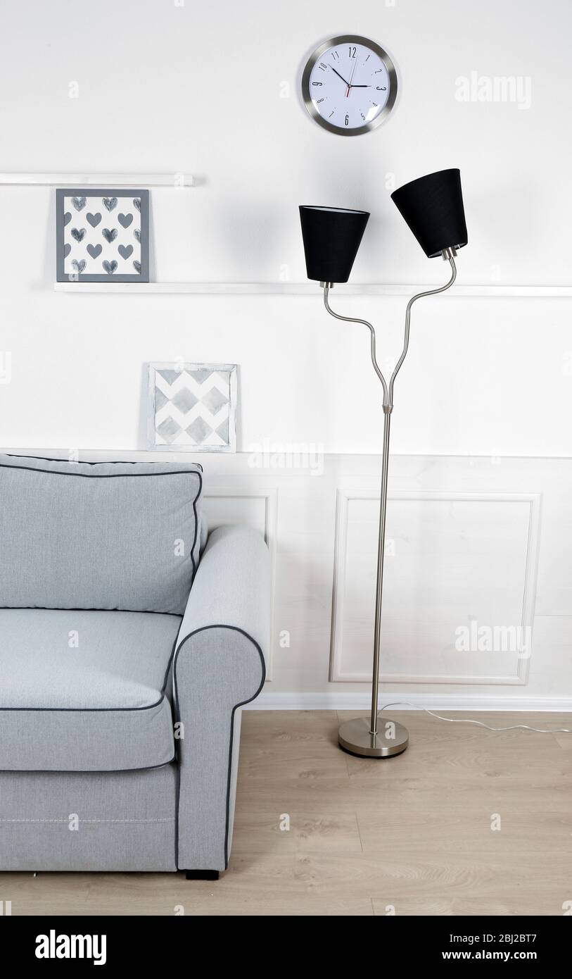Beautiful modern living room with grey sofa and floor lamp Stock Photo ...