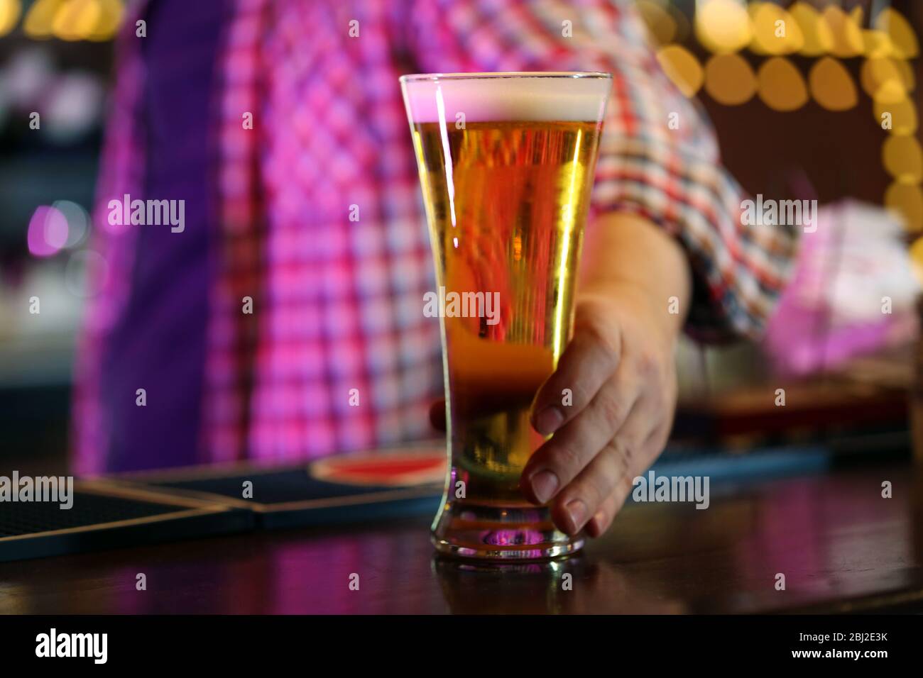 Bartender holding beer hi-res stock photography and images - Alamy