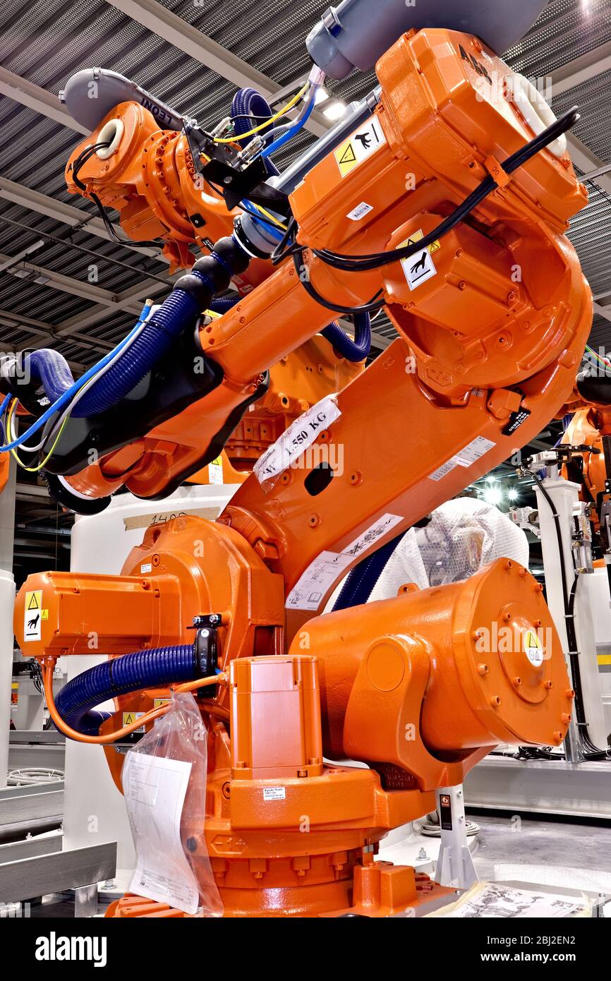 Robotic manipulator arm with spot welding attachment as used in vehicle