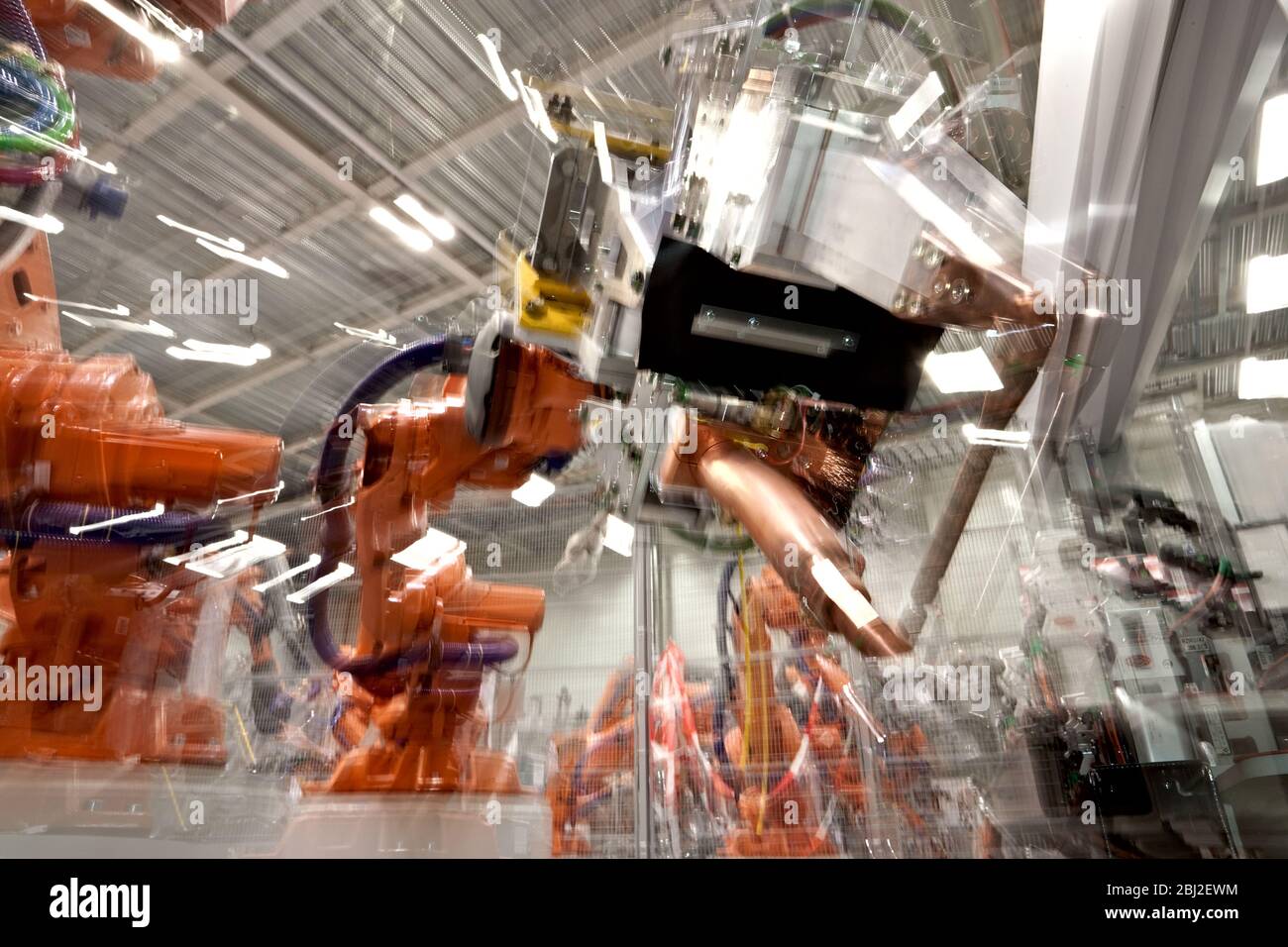 Robotic manipulator arm with spot welding attachment as used in vehicle assembly Stock Photo