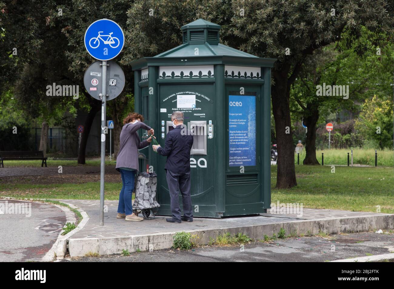 Roma, Italy. 28th Apr, 2020. Some people stock up on drinking water at the vending machine near the entrance to the Auditorium (Photo by Matteo Nardone/Pacific Press) Credit: Pacific Press Agency/Alamy Live News Stock Photo
