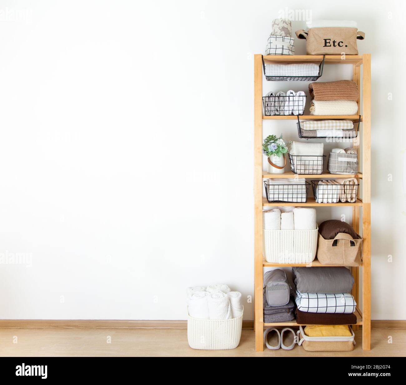 Bed sheets, duvet covers and towels are folded vertically. Metal and