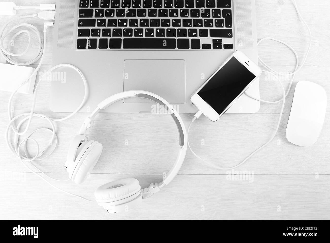 Computer peripherals and laptop accessories on white wooden background