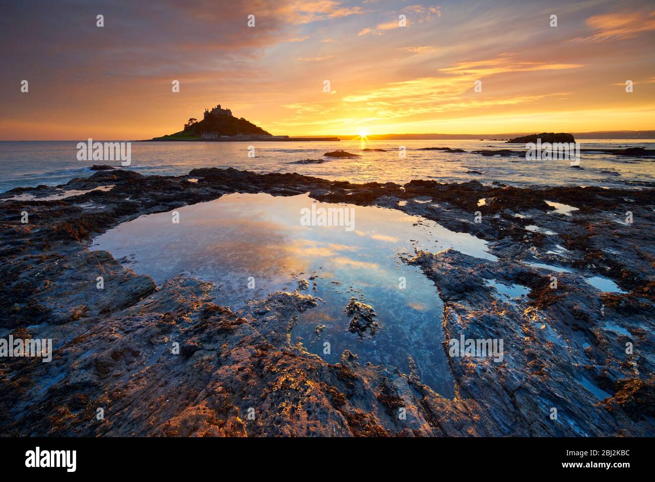 A golden sunset over Mounts Bay and St Michael's Mount, West Cornwall Stock Photo