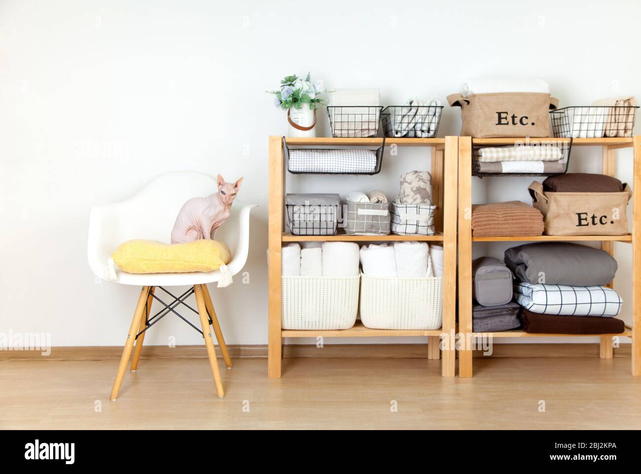 Bed sheets, duvet covers and towels are folded vertically. Metal and