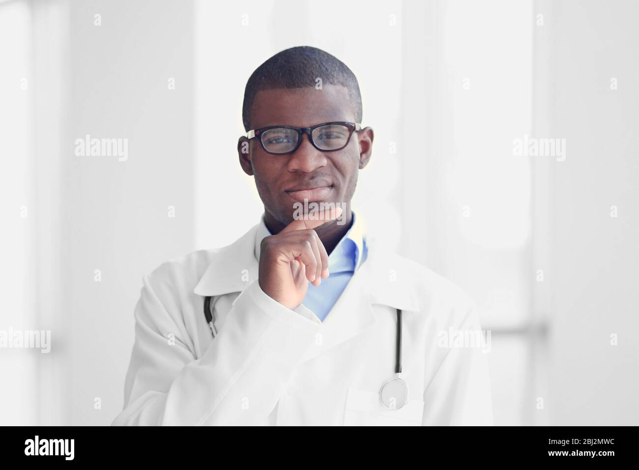 Black man lab coat thinking hi-res stock photography and images - Alamy