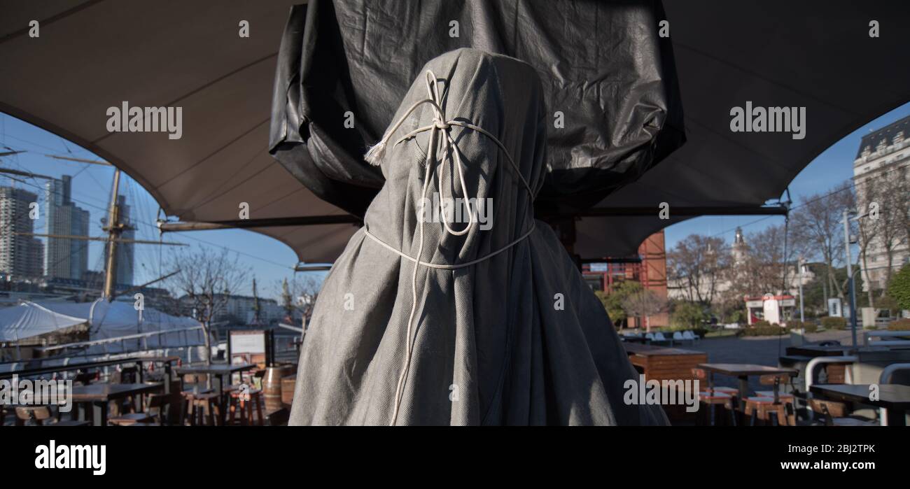 Captive figure covered by a cloth and tied with a rope. Stock Photo