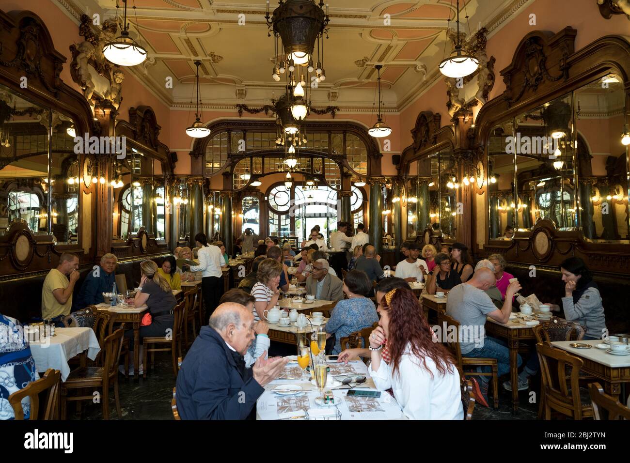 Diners in the famous traditional Majestic Cafe in Santa Catarina, Porto, Portugal Stock Photo
