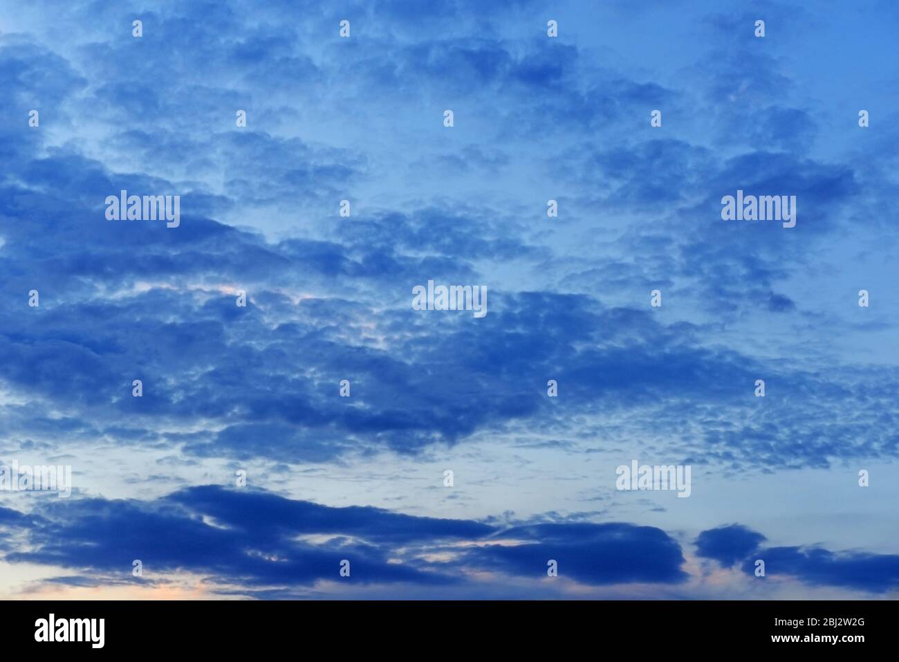 Sunset cloudy sky background Stock Photo - Alamy