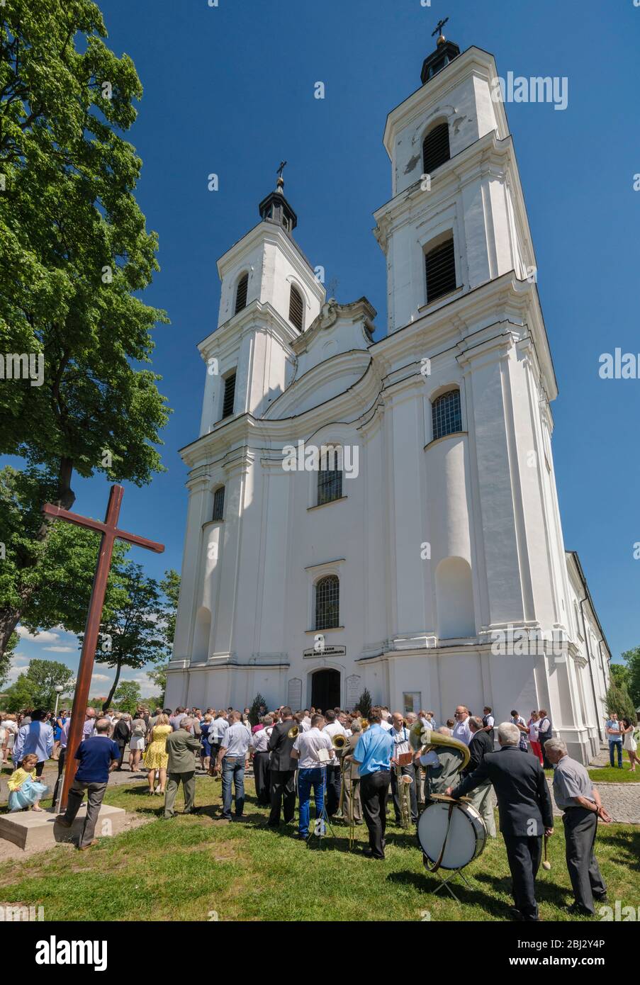 Norbertine Church, baroque style, village orchestra, Sunday Mass crowd, in village of Witow near Piotrkow Trybunalski, Western Mazovia, Poland Stock Photo