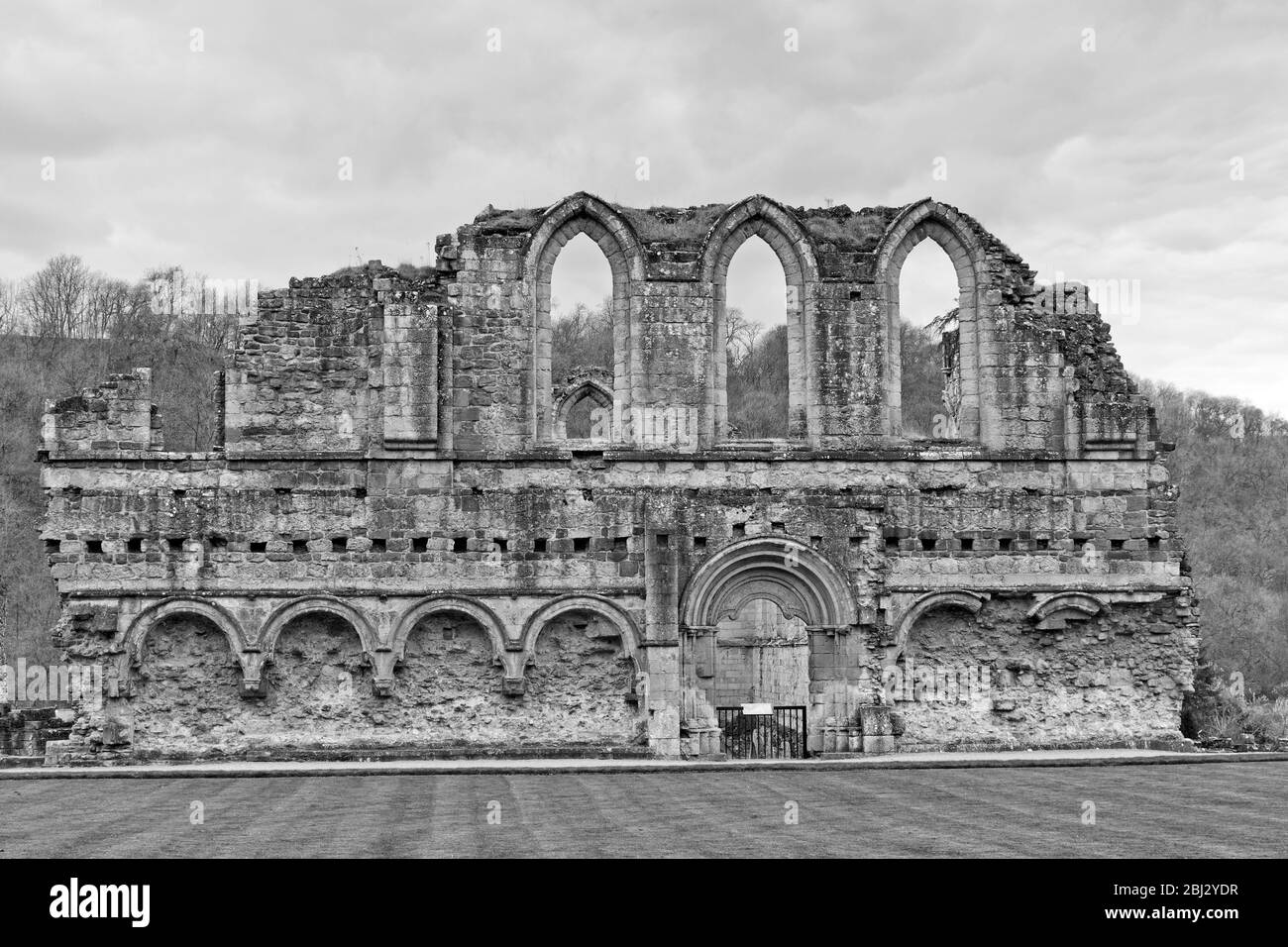 Refectory wall viewed from the cloisters at Rievaulx Abbey North Yorkshire Stock Photo