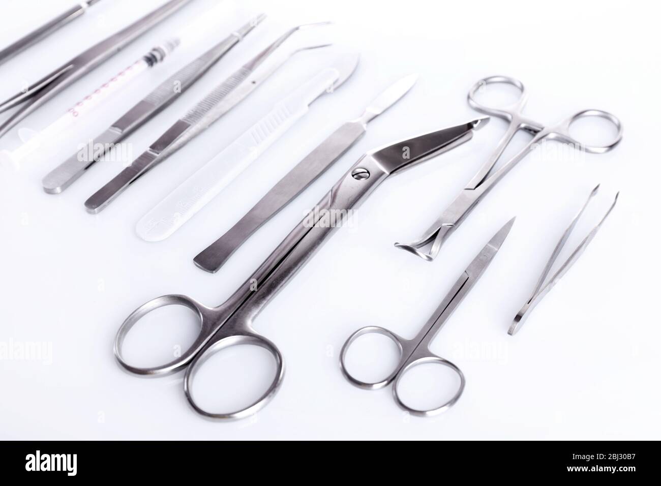 Surgery instruments isolated on white Stock Photo - Alamy