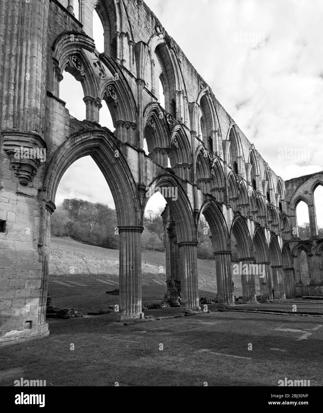 Arcades of the north wall of the presbytery of the church at Rievaulx Abbey North Yorkshire Stock Photo
