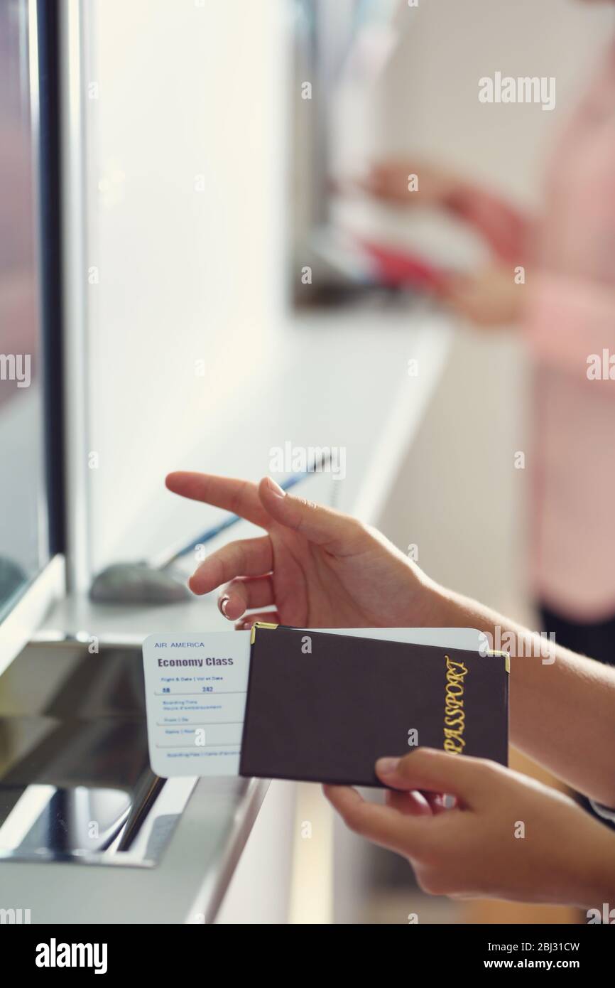 Airport Check-In Counters With Passengers Stock Photo - Alamy