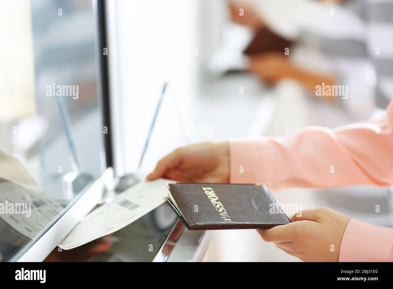 Airport Check-In Counters With Passengers Stock Photo - Alamy