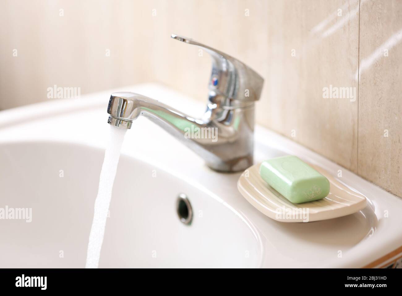 Washing of hands with soap under running water Stock Photo - Alamy