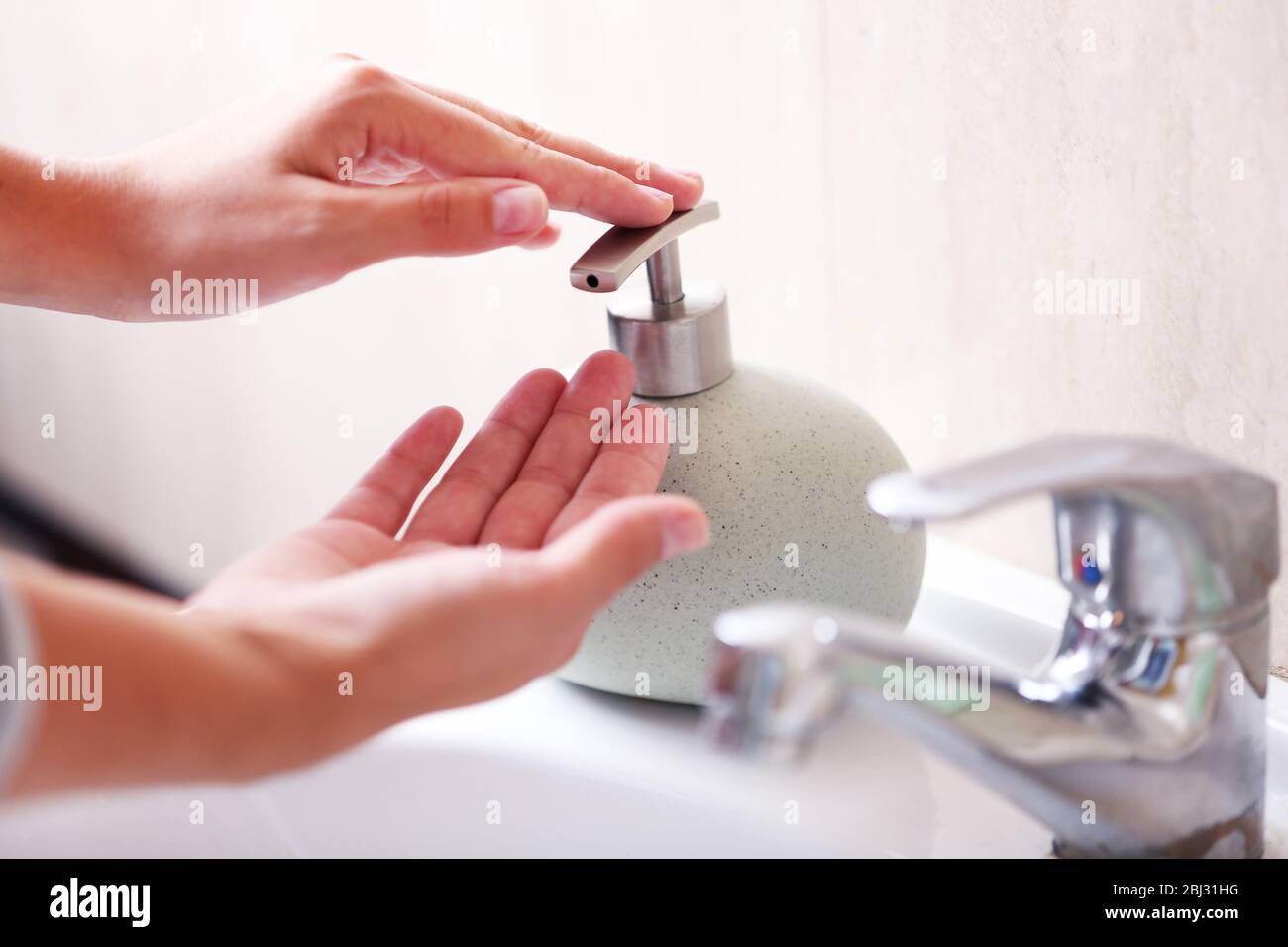 Washing of hands with soap under running water Stock Photo - Alamy