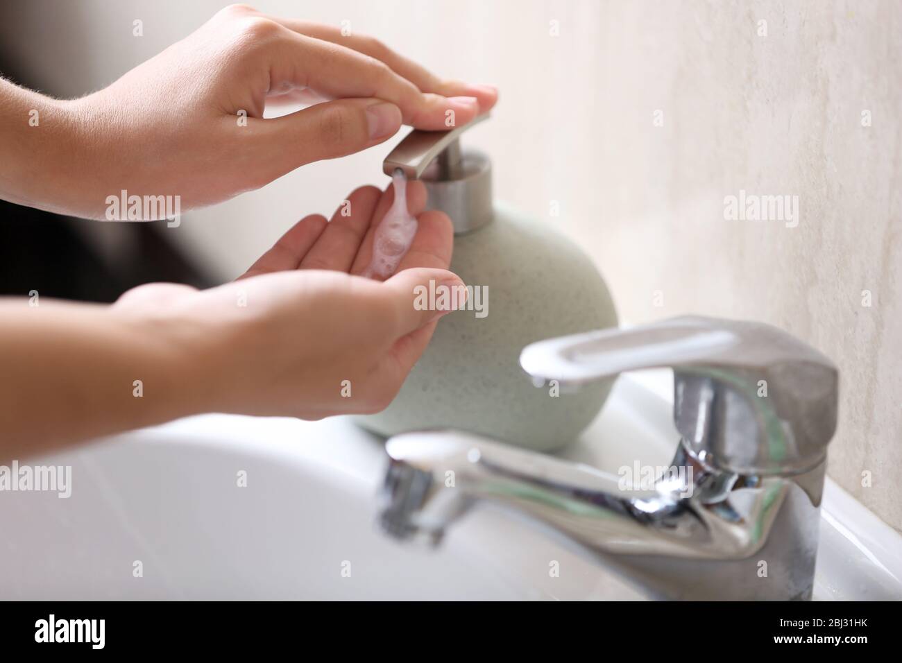Washing of hands with soap under running water Stock Photo - Alamy