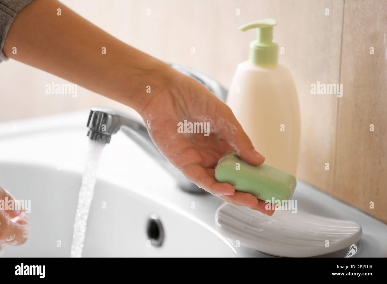 Washing of hands with soap under running water Stock Photo - Alamy