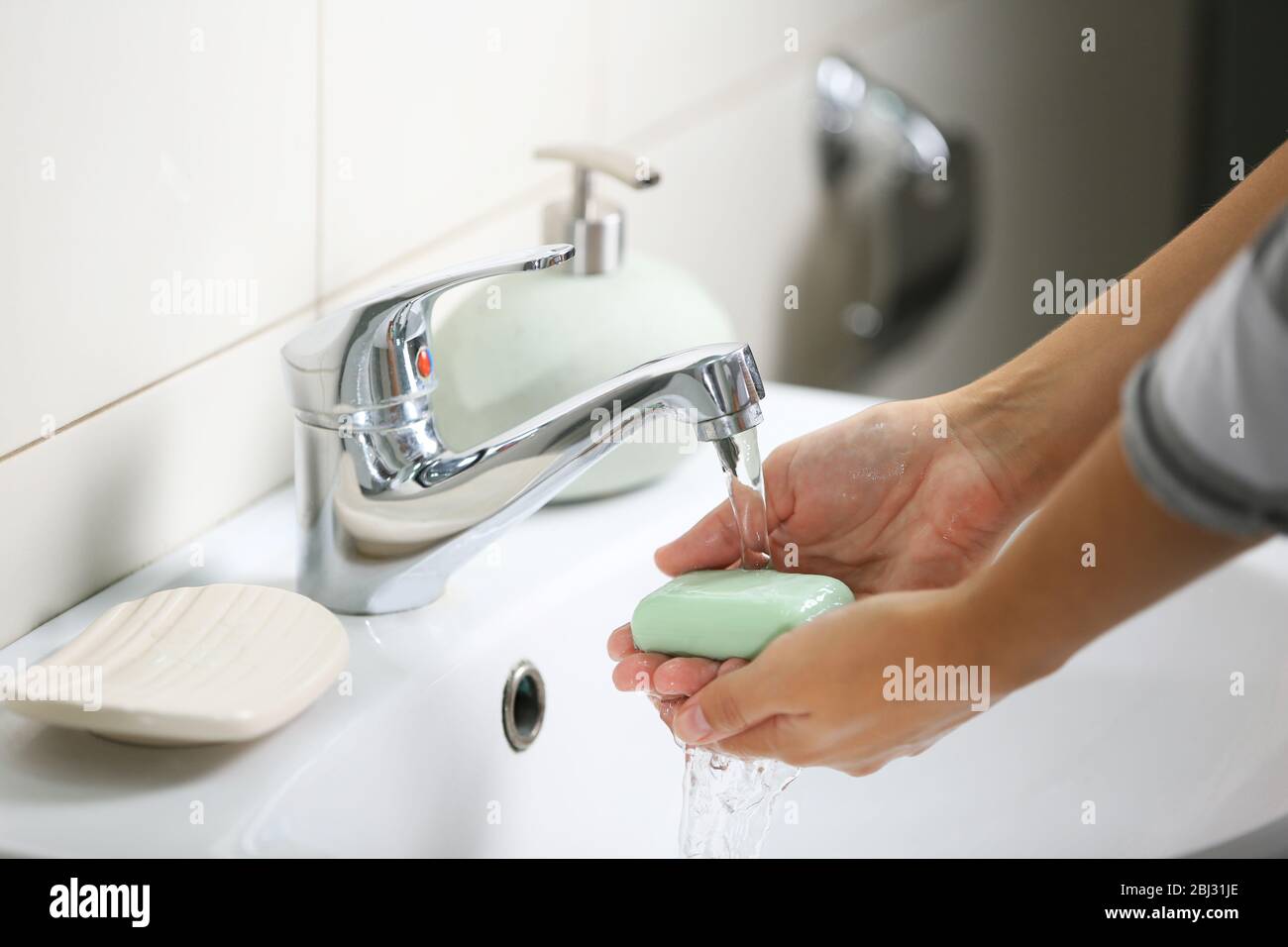 Washing of hands with soap under running water Stock Photo - Alamy