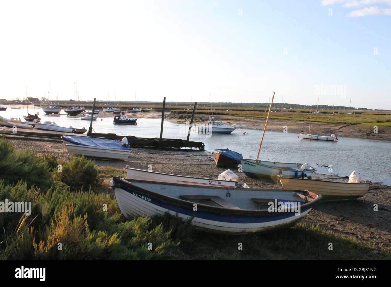 Boats at Low Tide Stock Photo - Alamy