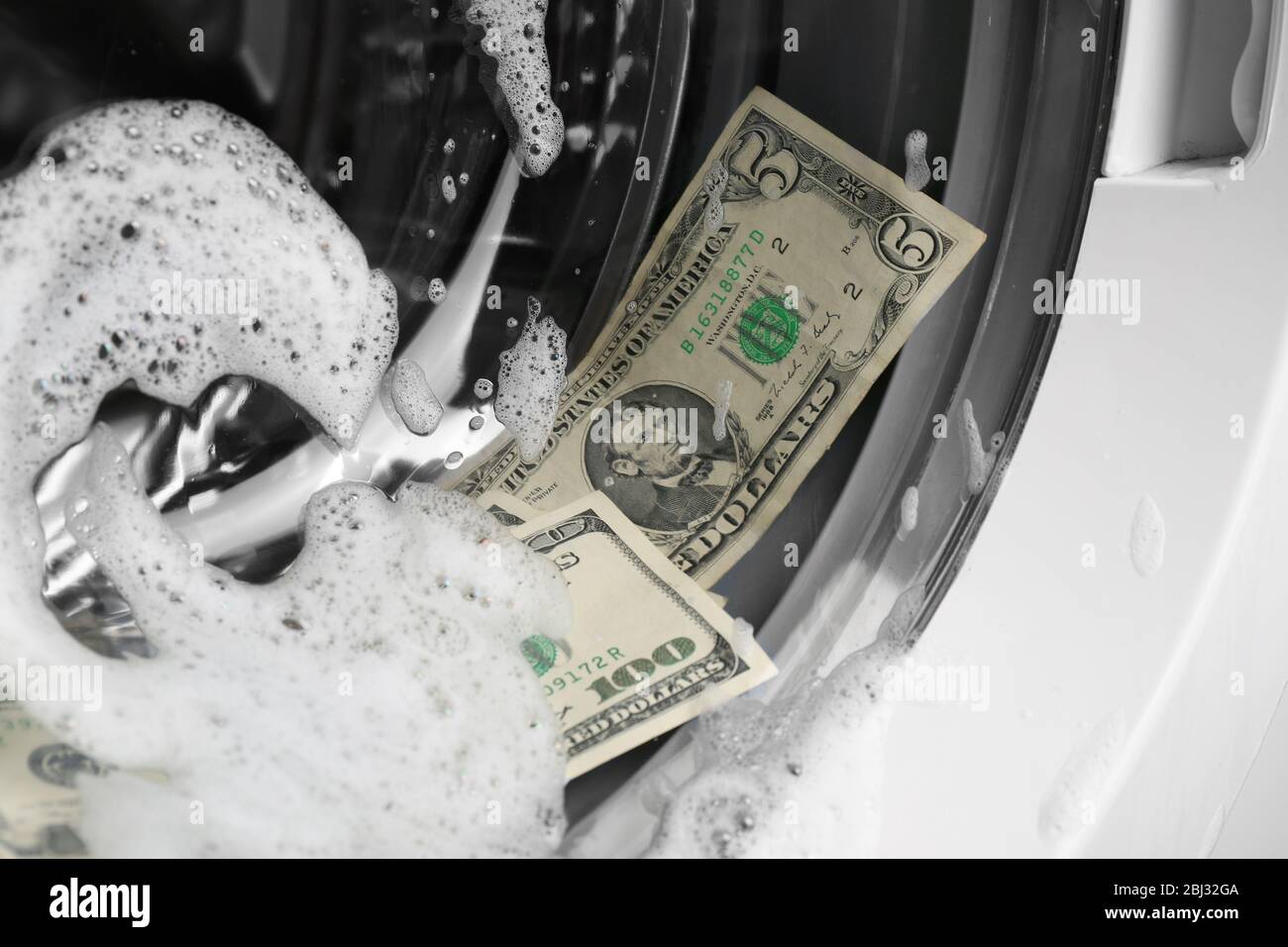 Laundering of dirty money in washing machine, close up Stock Photo Alamy