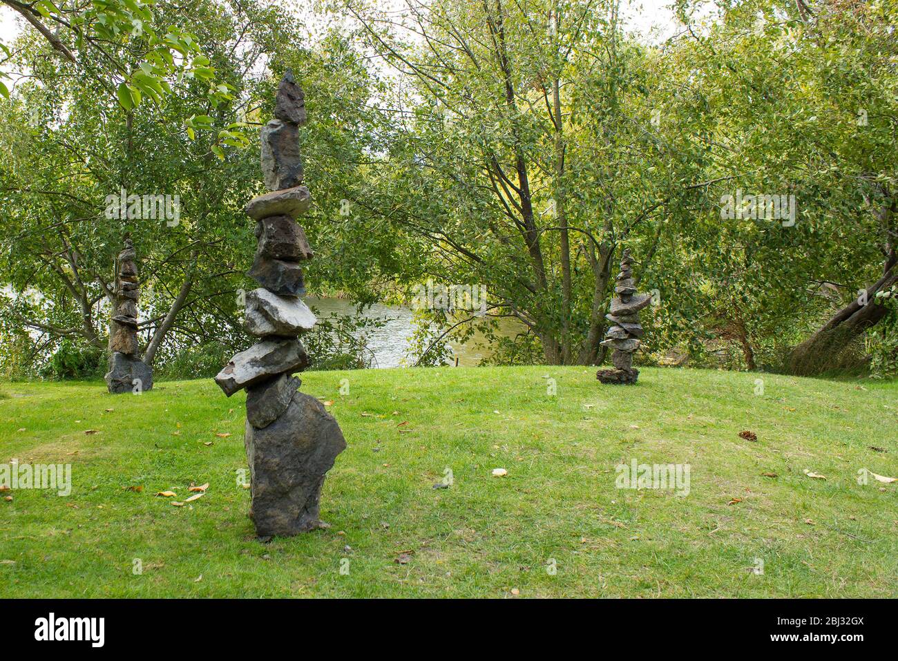 Statues of stone standing in the woods. Equilibrium Stock Photo