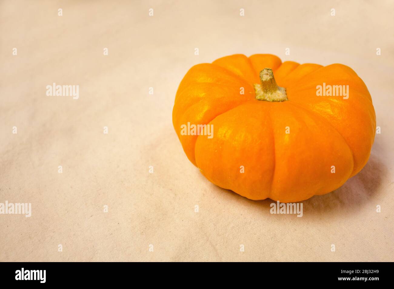 Pumpkins on fabric canvas a sacking Stock Photo