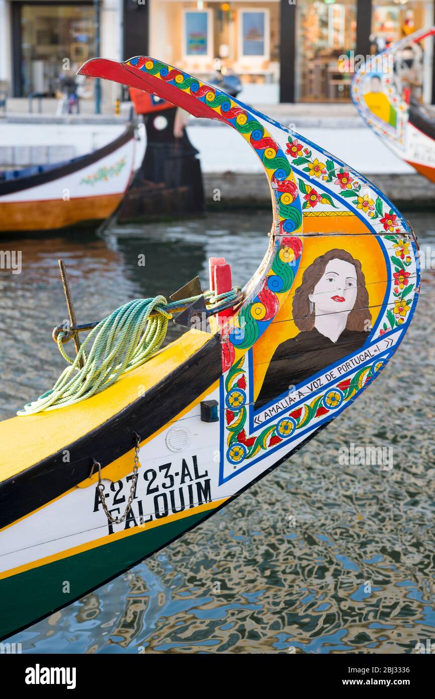 Traditional brightly painted gondola style moliceiro canal boat with painted prow in Aveiro, Portugal Stock Photo