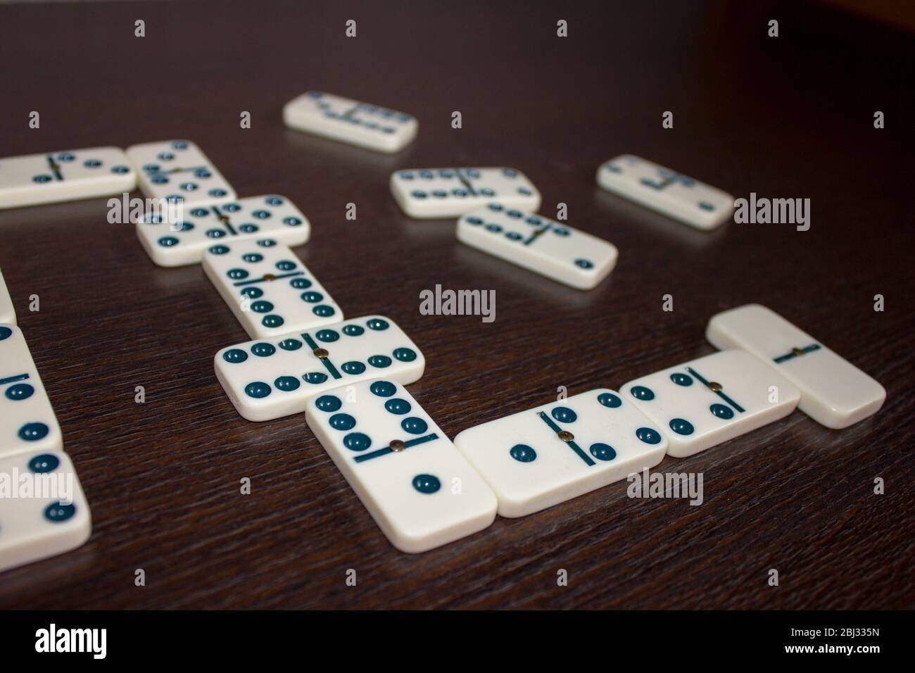 Dominoes on background wooden table Stock Photo