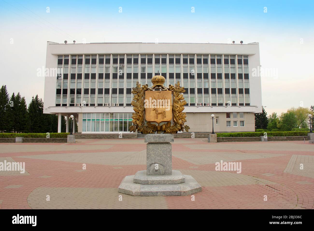 Tomsk. Russia. Coat of arms in the area. Tomsk Region Administration building Stock Photo