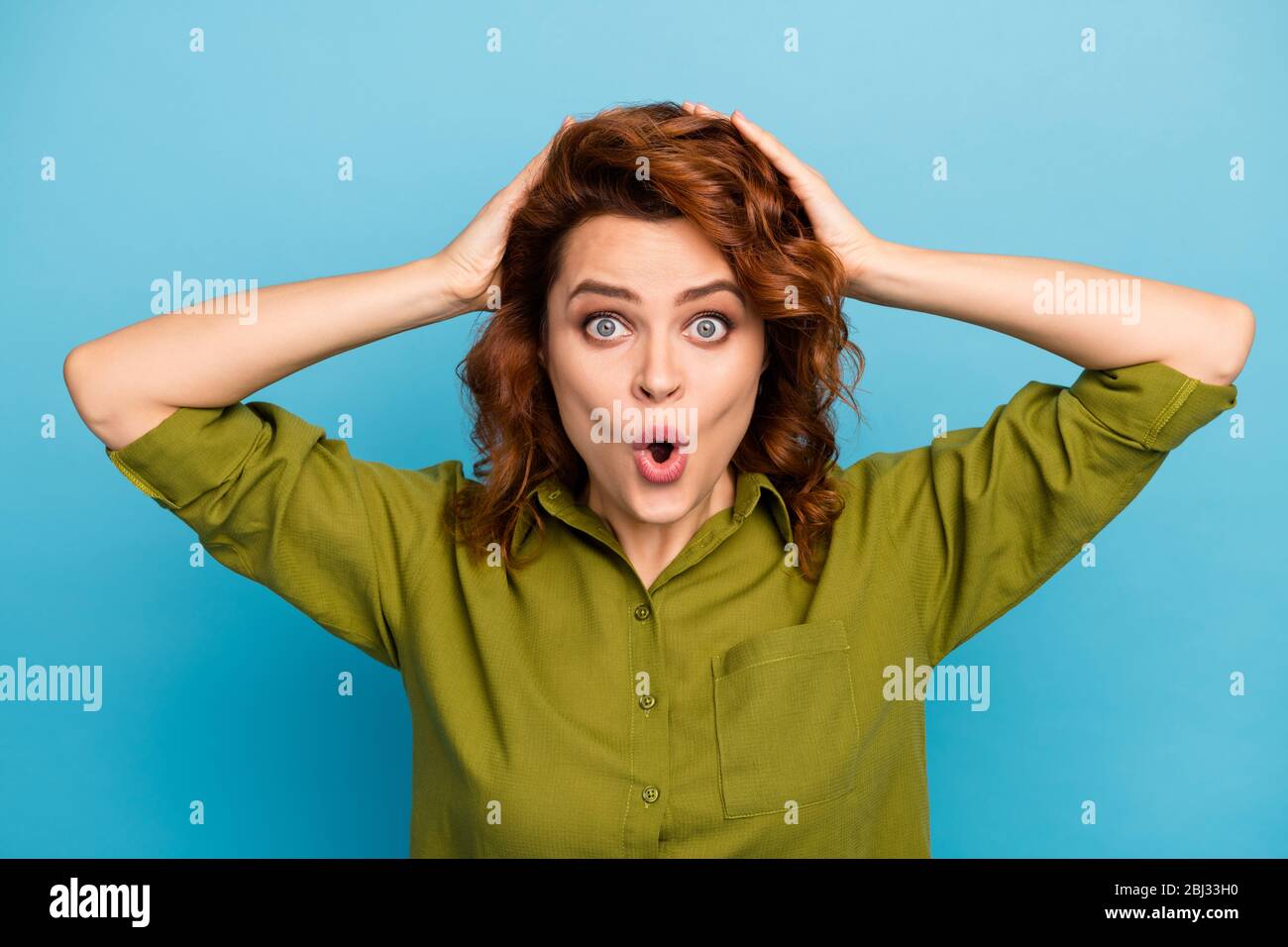 Portrait of astonished crazy woman hear wonderful unbelievable work information impressed touch palms hairstyle scream shout yell wear good look Stock Photo