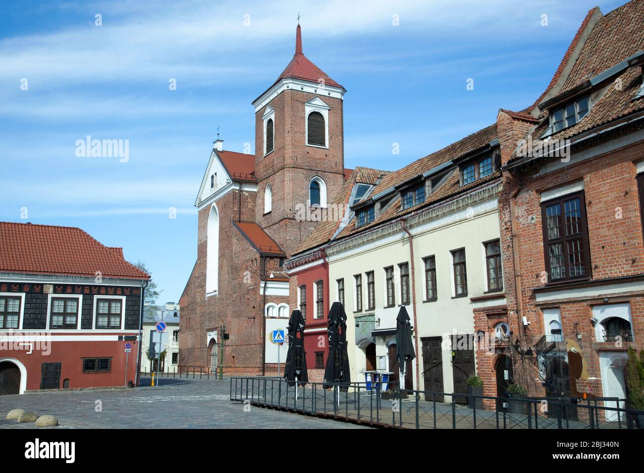 Cathedral Basilica of apostles St. Peter and St. Paul surrounded by empty streets of Kaunas old town during corona virus quarantine (Lithuania). Stock Photo
