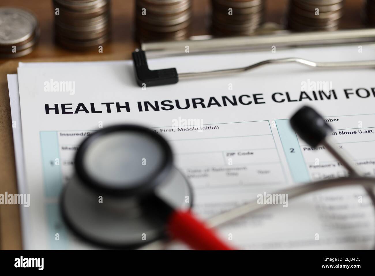 Filling out document health insurance claim form Stock Photo Alamy