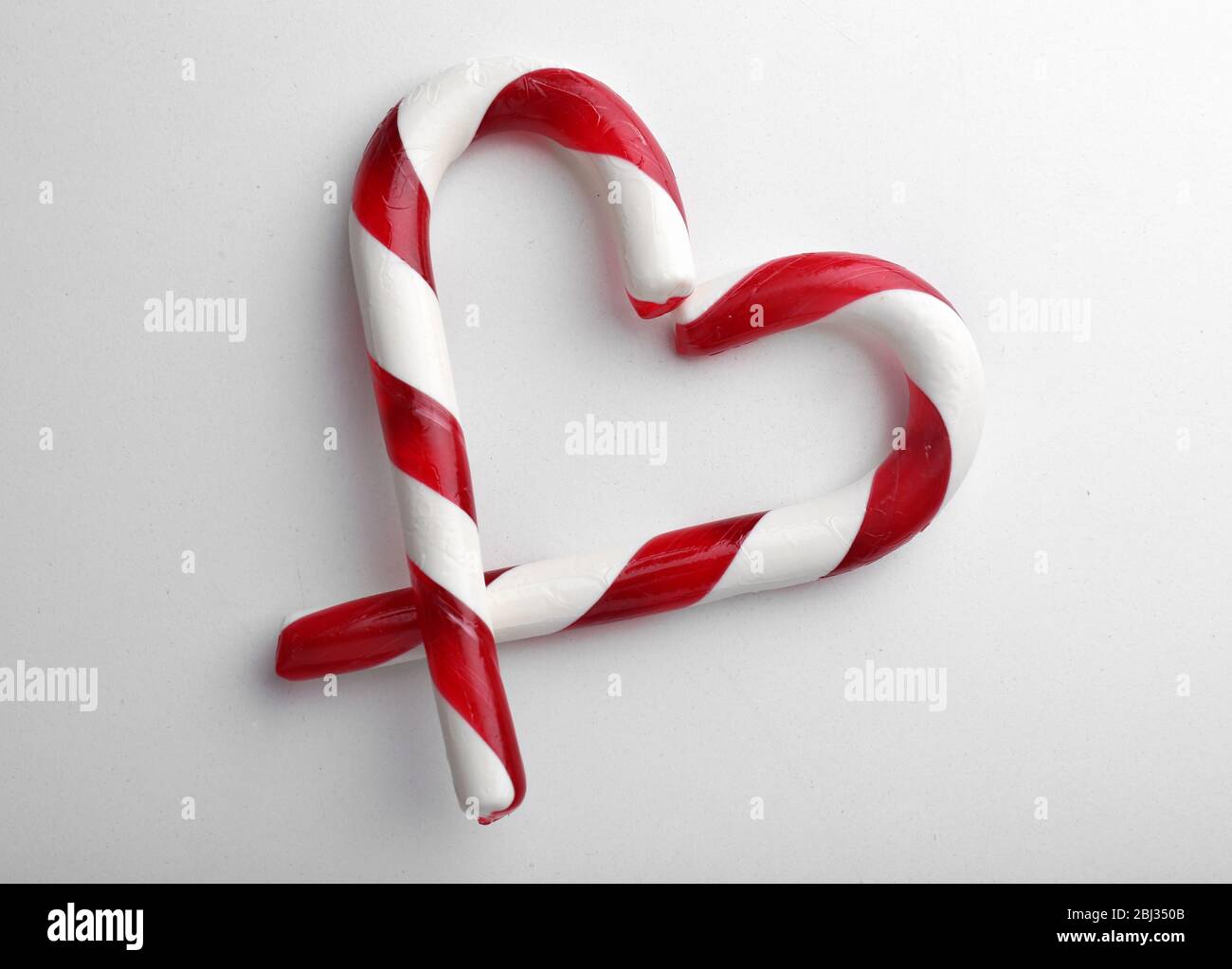 Christmas Candy Canes isolated on white Stock Photo - Alamy