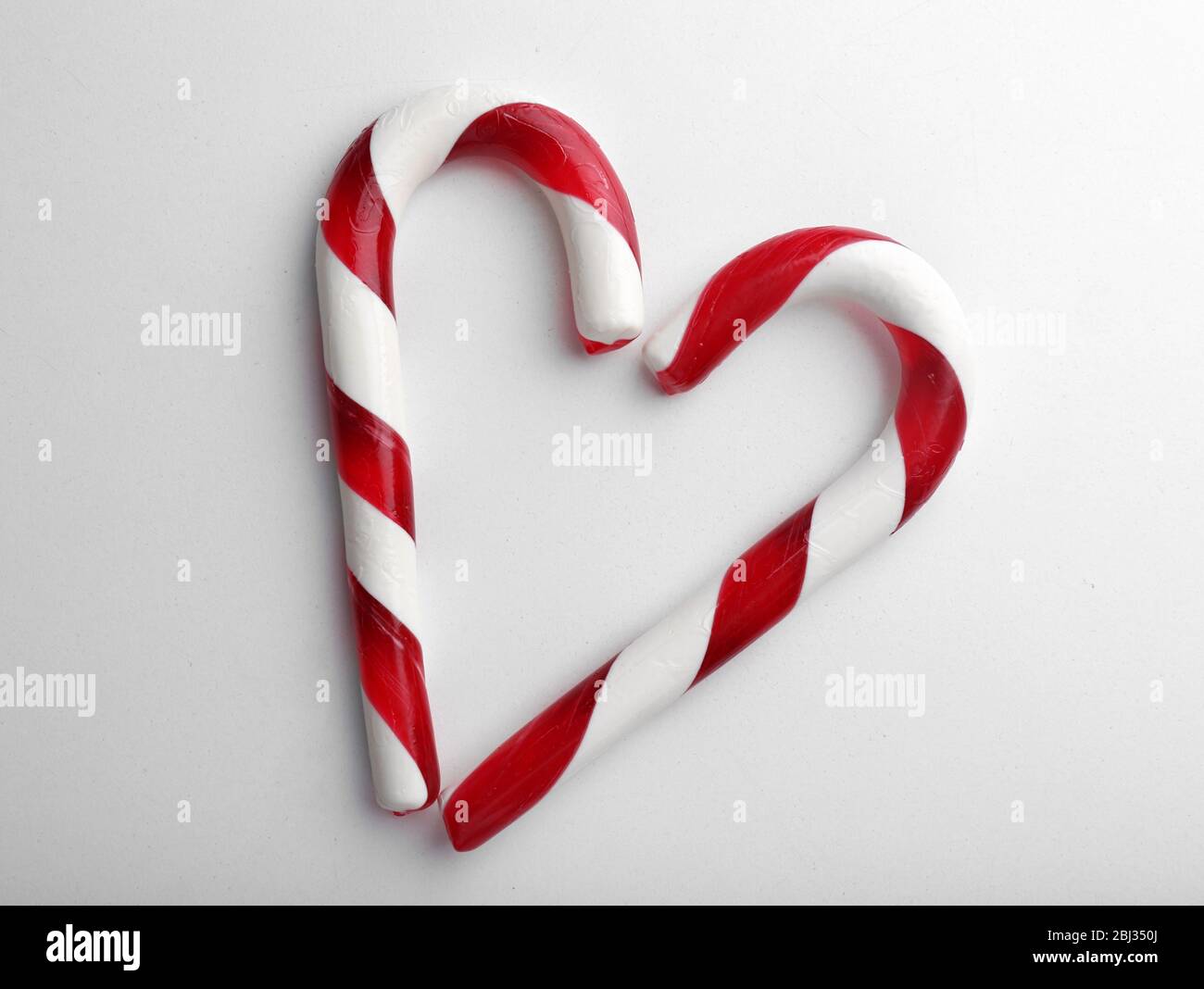 Christmas Candy Canes isolated on white Stock Photo - Alamy
