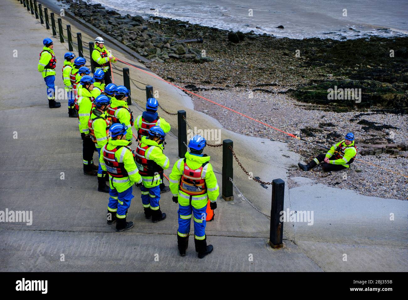 Coastguard Rescue members during a training exercise on the sea Wall to Marine Lake at Weston Super Mare. Stock Photo
