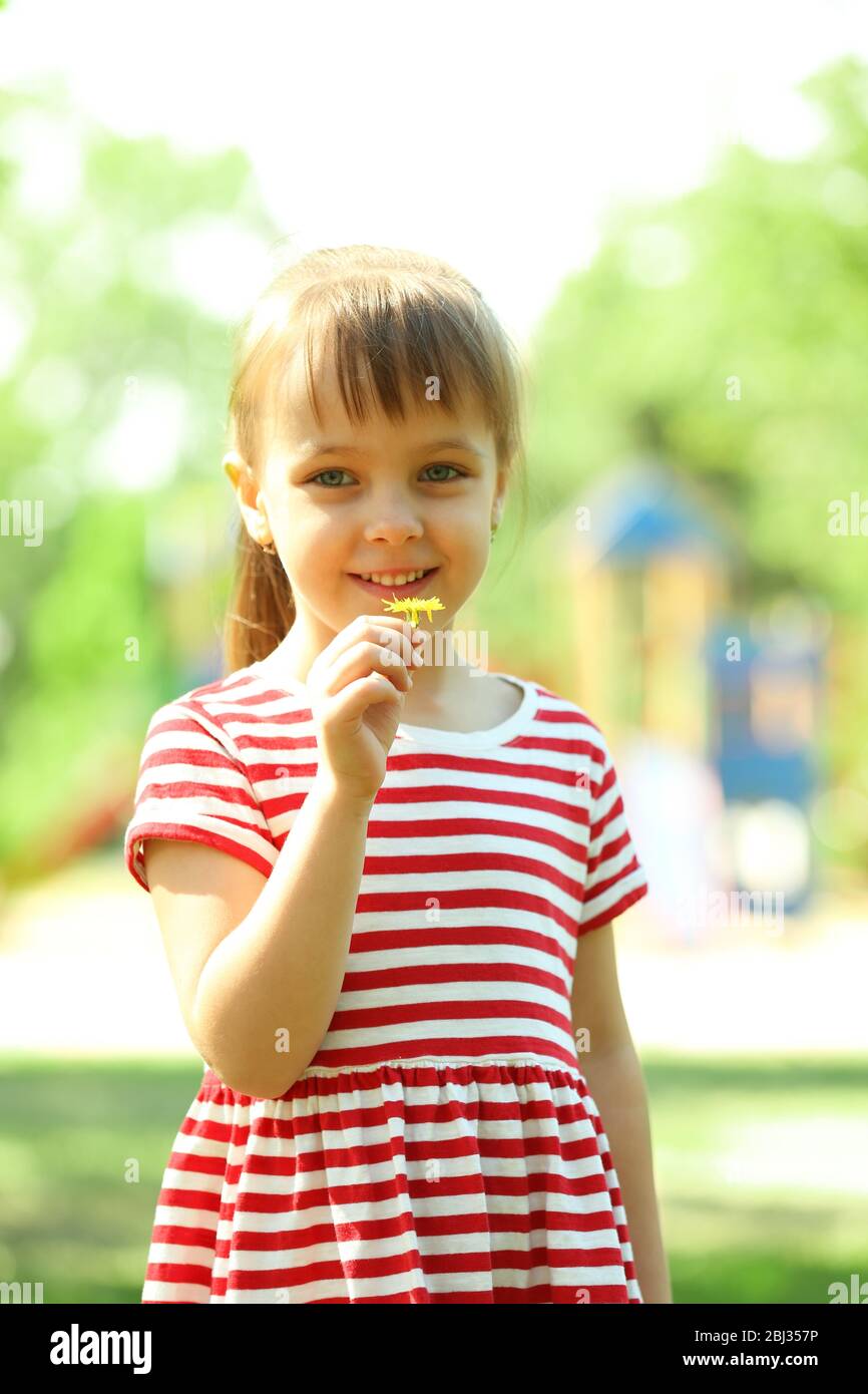 Little happy girl playing in park near the playground Stock Photo - Alamy