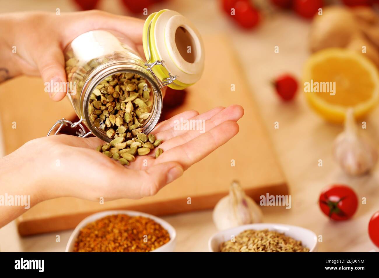 Cardamon and variety of spices on the kitchen table Stock Photo - Alamy