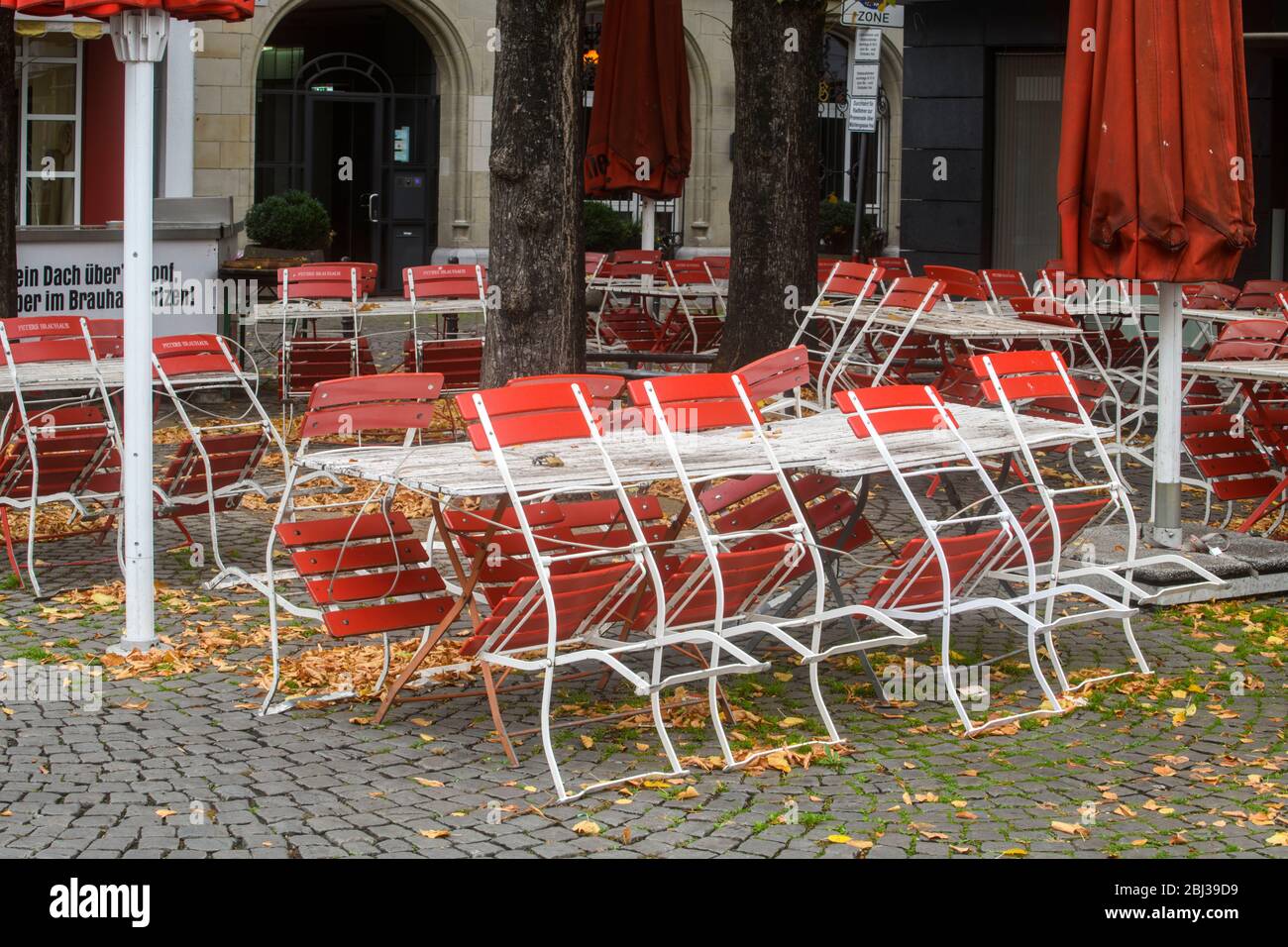 Outdoor cafe furniture in late autumn, Cologne, North Rhine-Westphalia , Germany Stock Photo