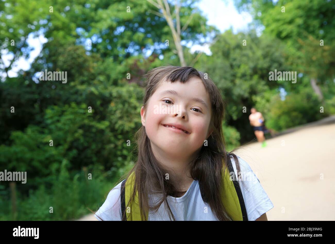 Portrait of little girl smiling in the park Stock Photo - Alamy