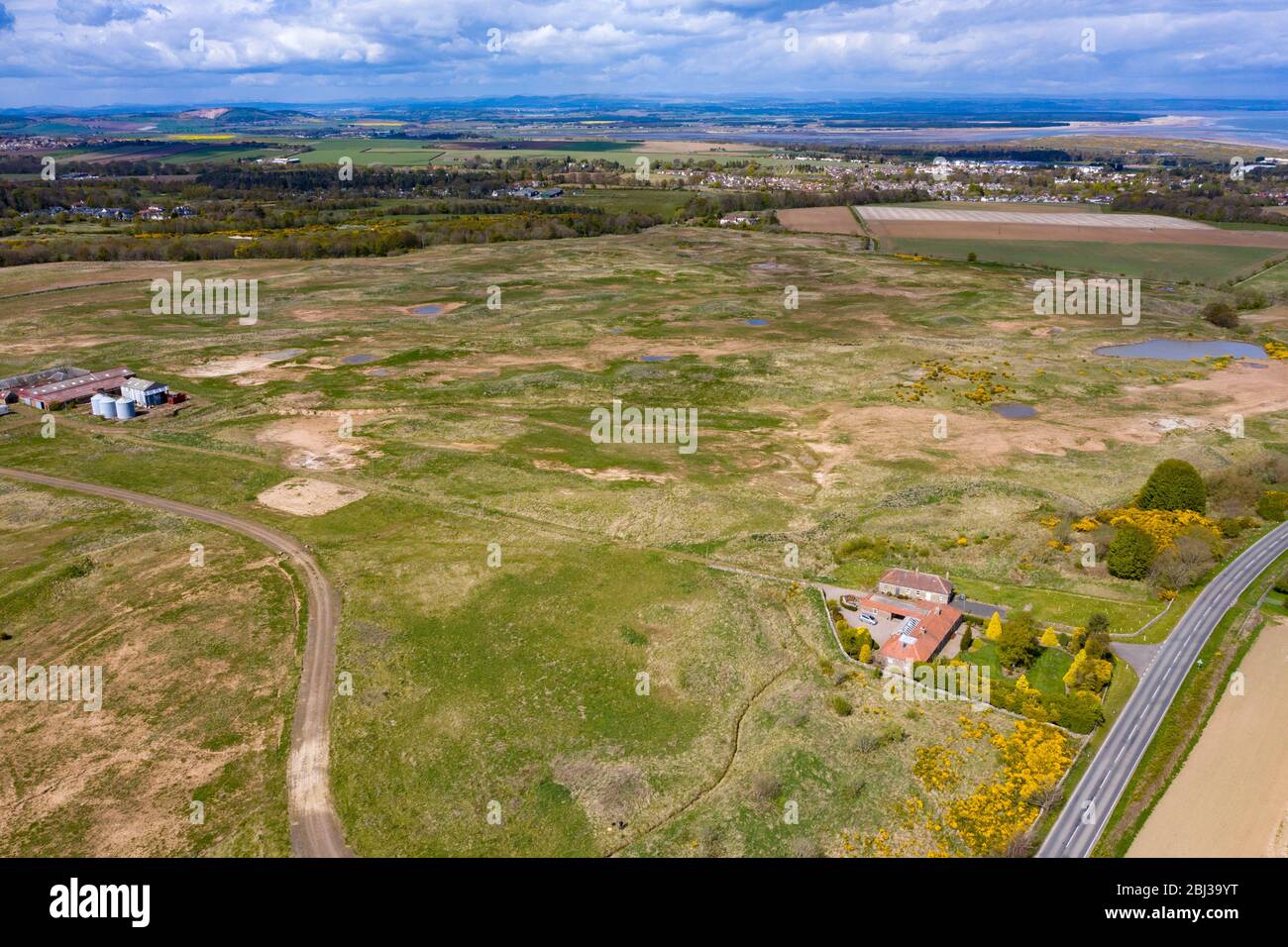St Andrews, Scotland, UK. 28 April 2020. Aerial view of Feddinch Mains, a 240 acre site outside St Andrews in Fife, that has gone on the market. The land includes a partially built golf course and planning permission for a new 18 hole golf course and clubhouse. Iain Masterton/Alamy Live News Stock Photo