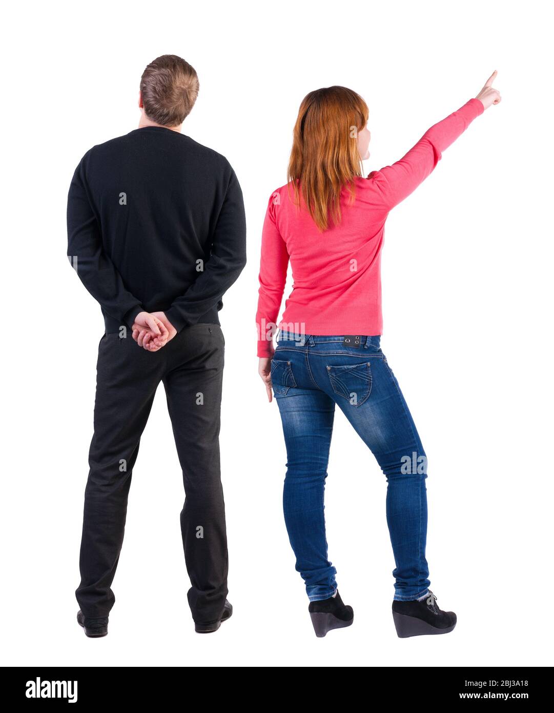 Back view of couple in sweater pointing. Rear view people collection ...