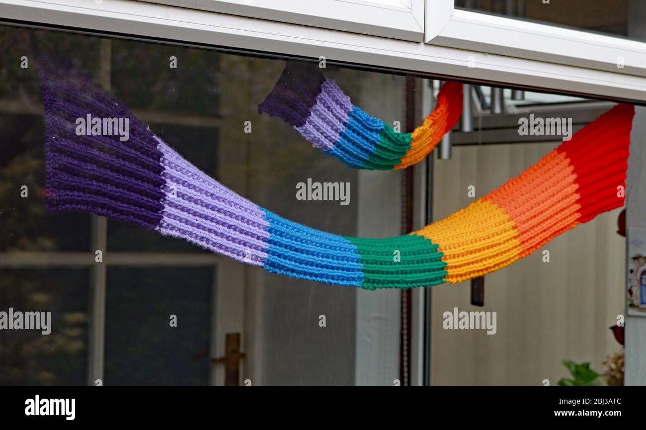 Rainbow scarves in a porch the scarves have been designed and knitted ...