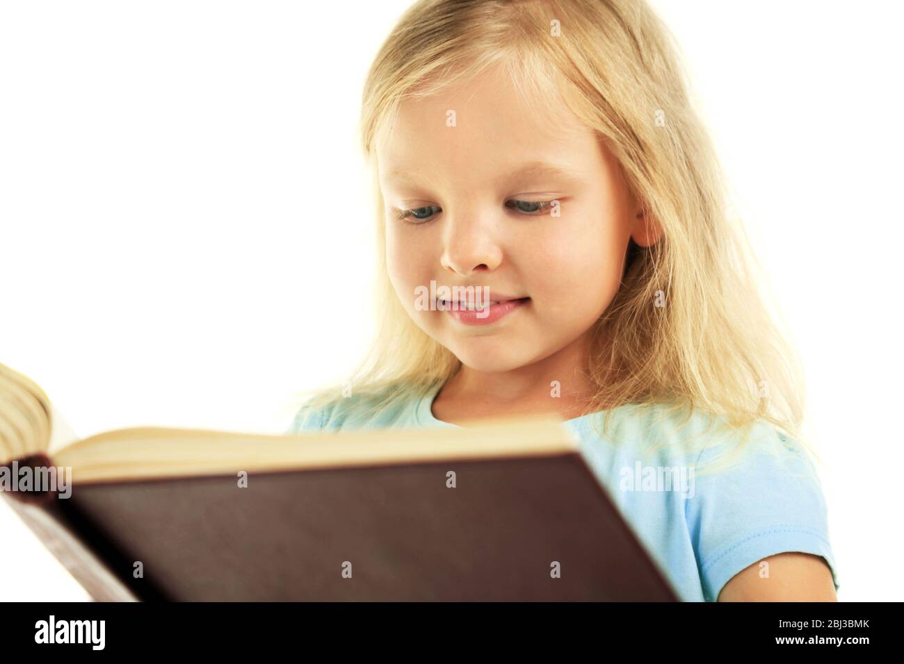 Beautiful little girl with book, isolated on white Stock Photo - Alamy