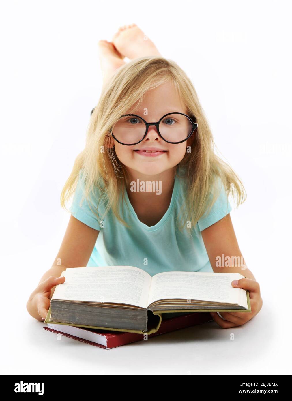 Beautiful little girl with book, isolated on white Stock Photo - Alamy