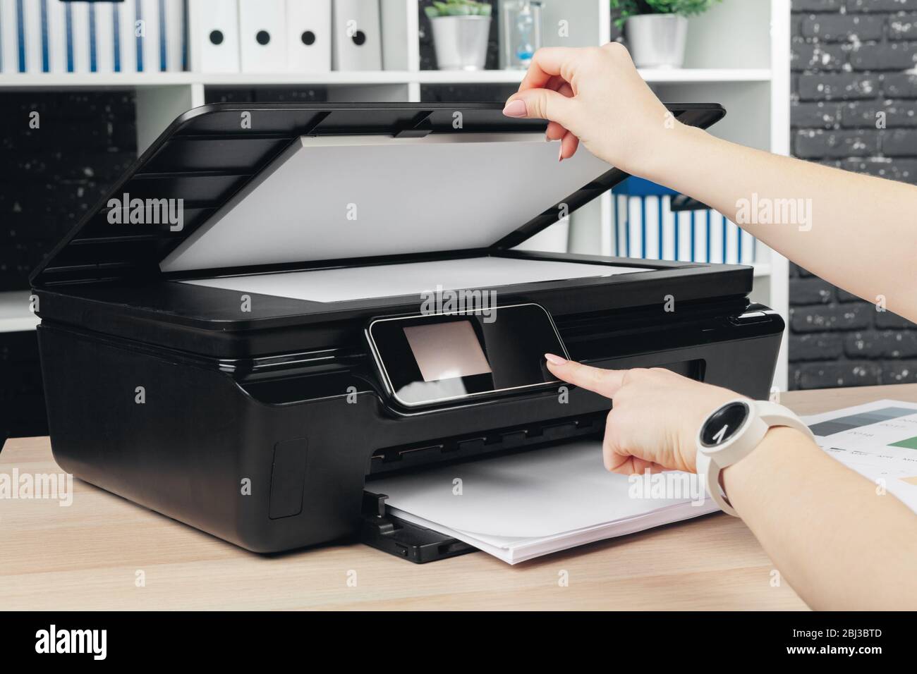 Woman Making Photocopy Using Copier In Office Stock Photo Alamy