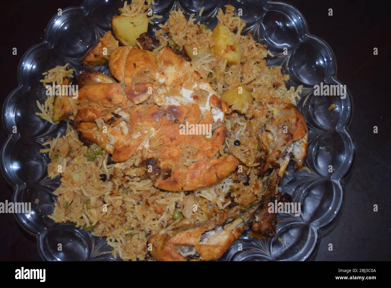 Roasted whole chicken with stuffed rice and potato Stock Photo Alamy