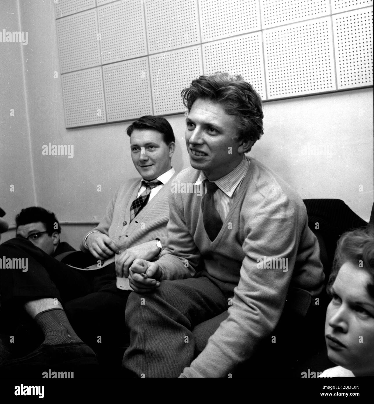 Tommy Stele sits in a recording studio next to John Kennedy who discovered him. Taken in the 1950s. Stock Photo