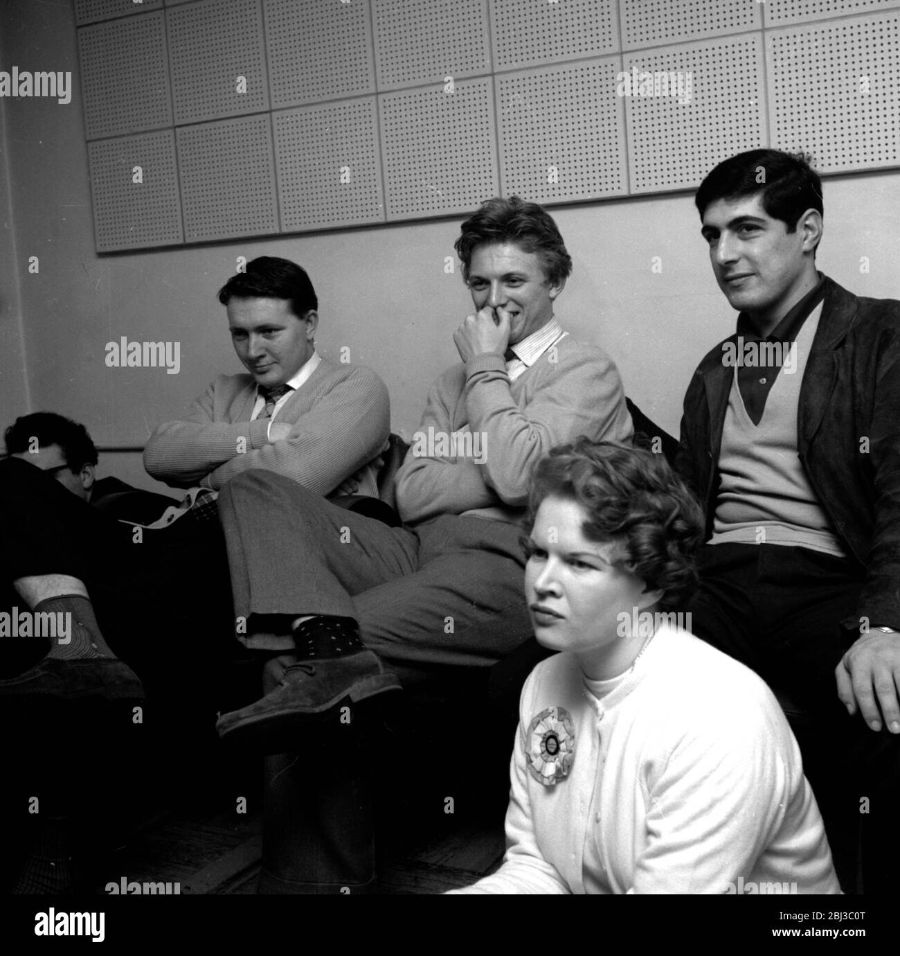 Tommy Stele sits in a recording studio flanked by John Kennedy and Larry Parnes, who discovered him. Taken in the 1950s. Stock Photo